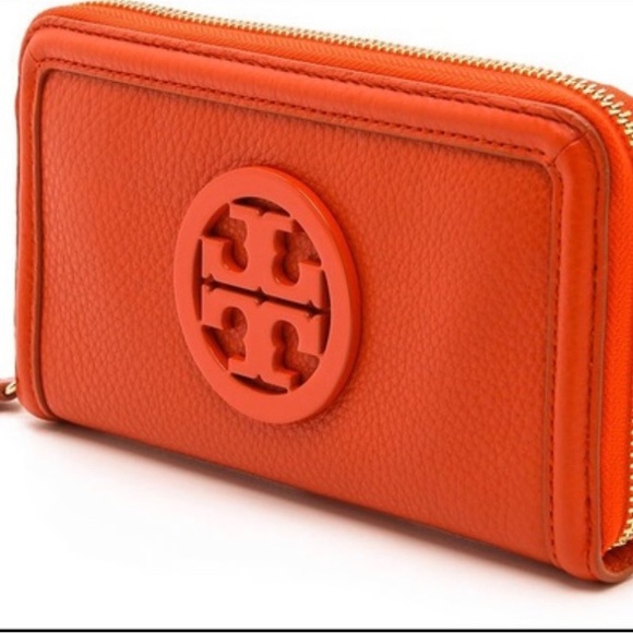 Tory Burch Handbags - Tory Burch Zip around wallet, orange pebbled leather in excellent condition!